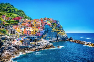 Village on cliff rocks and sea at sunset., Seascape in Five lands, Cinque Terre National Park, Liguria Italy Europe.
